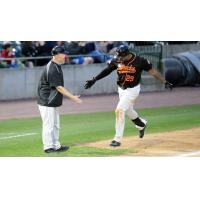 Daniel Fields gets a low five from Long Island Ducks player/coach Lew Ford