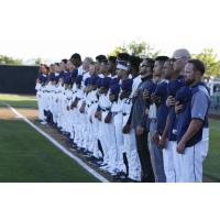Tri-City Dust Devils stand for the National Anthem