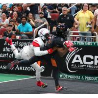 Anthony Amos of the Arizona Rattlers is tackled into the endzone